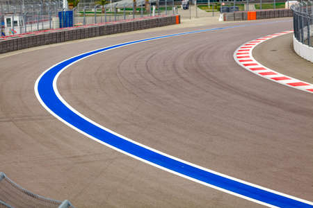 Motor racing track. Turning asphalt road with marking linesの写真素材