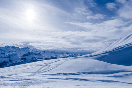 mountain in winter, covered of snow.  turns in a sunny dayの写真素材