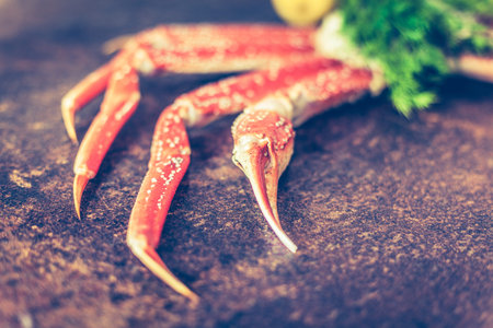 Seafood. Crab Legs.  crab legs with fresh lemonの写真素材