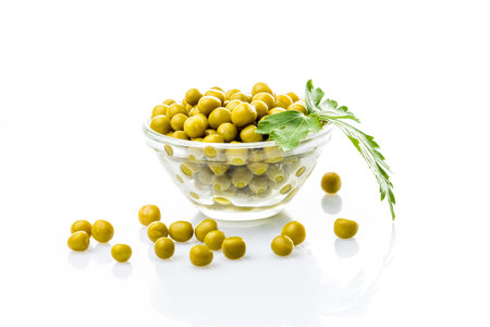 green peas  in a bowl isolated, white backgroundの写真素材