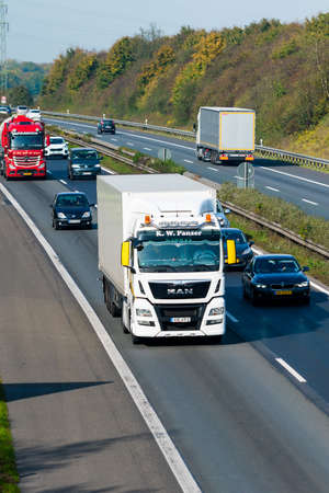 DUSSELDORF ,GERMANY - OKTOBER 19: transport truck on the highway on Oktober 19,2017 in Dusseldorf, Germany. truck on asphalt roadのeditorial素材