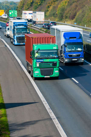 DUSSELDORF ,GERMANY - OKTOBER 19: transport truck on the highway on Oktober 19,2017 in Dusseldorf, Germany. truck on asphalt roadのeditorial素材