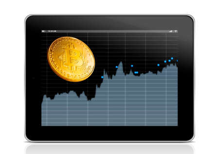 virtual money Bitcoin cryptocurrency. tablet with business chart and golden bitcoinの写真素材