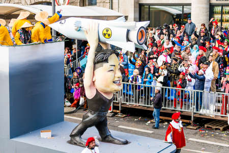 COLOGNE, GERMANY - FEBRUAR 12, 2018: people at the Carnival parade on Februar 12 , 2018  in Cologne. Kim Jong-un with Nuclear Missileのeditorial素材