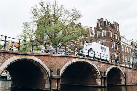 Amsterdam, Netherlands - September 5, 2017: City view of Amsterdam with bridges and bicycles in the Netherlandsのeditorial素材