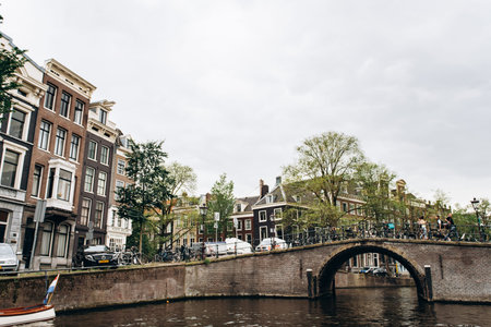 Amsterdam, Netherlands - September 5, 2017: City view of Amsterdam with bridges and bicycles in the...