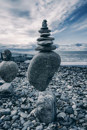 Balance stones against the seaの写真素材