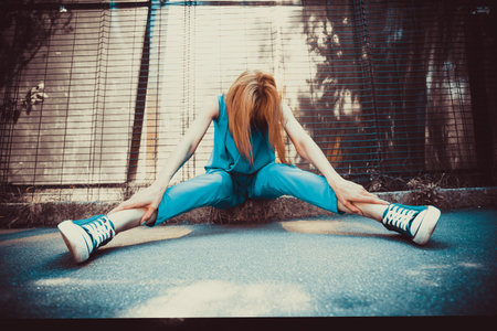 Girl sitting on floorの写真素材