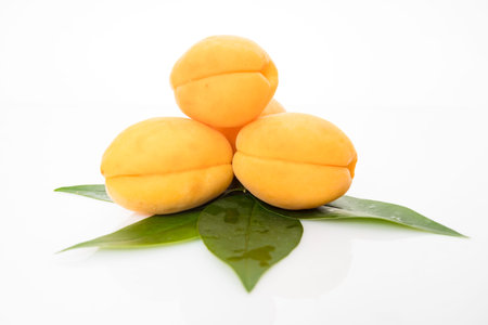 Apricot fruit with leaf  isolated on white backgroundの写真素材