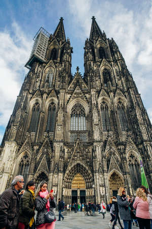COLOGNE, GERMANY - November 07, 2018: Tourists walk around beneath Cologne's cathedral on November 07, 2018 in Cologne, Germanyのeditorial素材