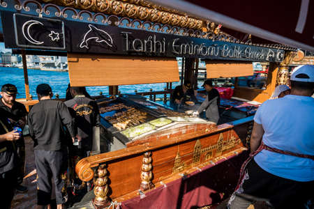 ISTANBUL, TURKEY - July 11 2017 :  View of the boats selling balik ekmek fish sandwiches from the Galata Bridge on July 11, 2017 in Istanbul, Turkeyのeditorial素材