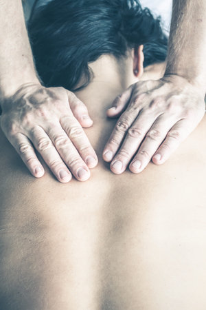 Close up of therapist doing massage on woman