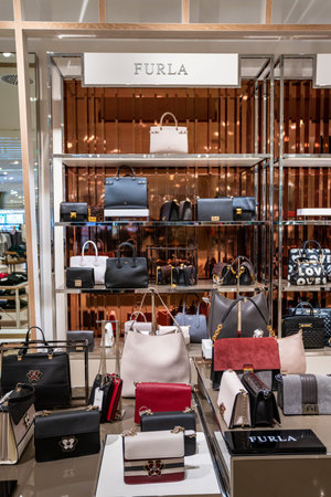 DUSSELDORF, GERMANY - 19 OCTOBER, 2019: Interior shot of Furla store in Breuninger luxury shopping...