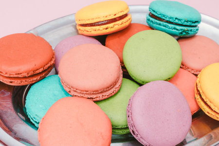 French Colorful Macarons on Pink Background