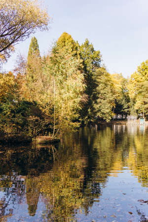 Reflection of autumn trees in the lake. Beautiful autumn landscape on the lake. Beautiful autumn landscape.の写真素材