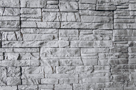 The texture of the brick wall is gray. Brick background