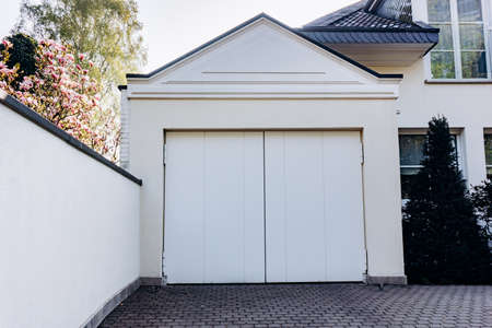 The door to the garage. Large garage doors near the houseの写真素材