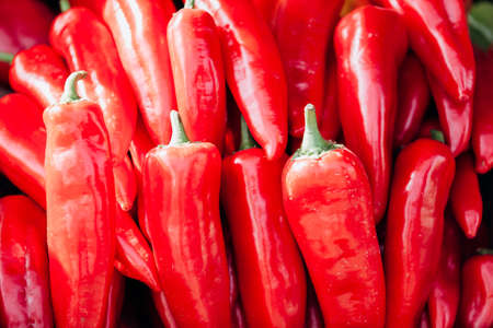 Heap Of Ripe Big Red Peppers as background. Background and red pepperの写真素材