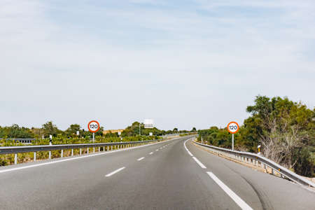 Paved road and beautiful green landscape in summerの写真素材