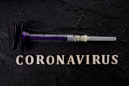 Coronavirus Vaccine Vial With Injection Syringe
