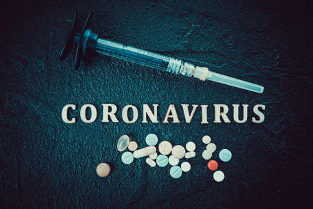 Coronavirus Vaccine Vial With Injection Syringeの写真素材