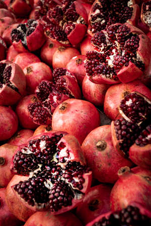 Cracked pomegranate. Ripe Pomegranates Backgroundの写真素材