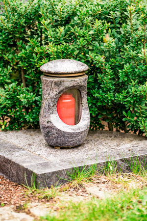 Old damaged grave lantern on a gravestoneの写真素材