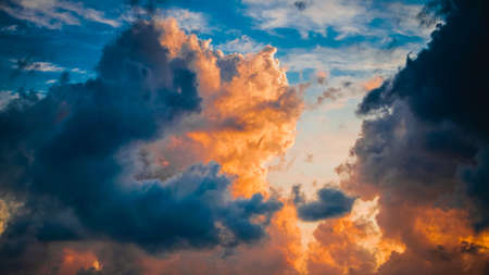 colorful dramatic sky with cloud at sunsetの写真素材