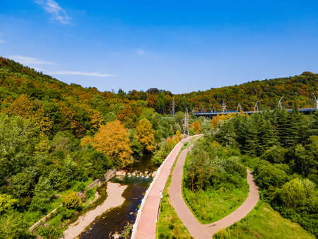 Aerial view of high bridge and mountain road with cars and truck, Sochi, Russiaの写真素材