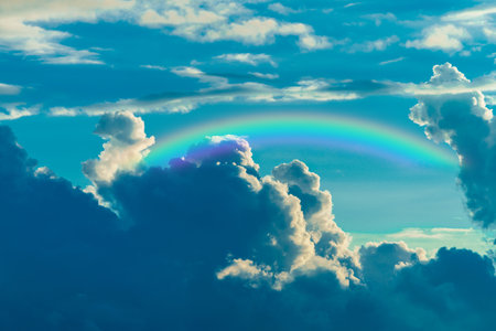 background of rainbow and the storm cloudsの写真素材
