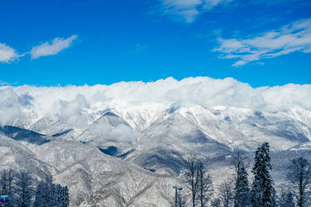 mountains with white snow and blue skyの写真素材