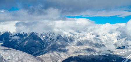 mountains with white snow and blue skyの写真素材