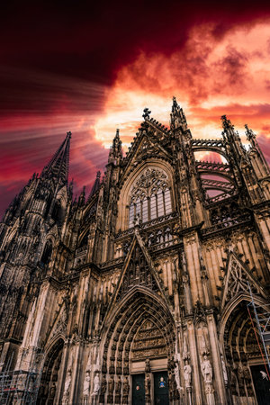 Germany, Cologne, view to Cologne Cathedral from below at sunsetの写真素材