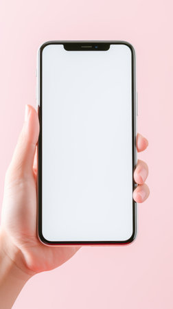 hand holding a smartphone with blank screenの素材