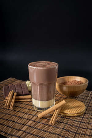 Delicious hot chocolate in a glass with cinnamonの写真素材