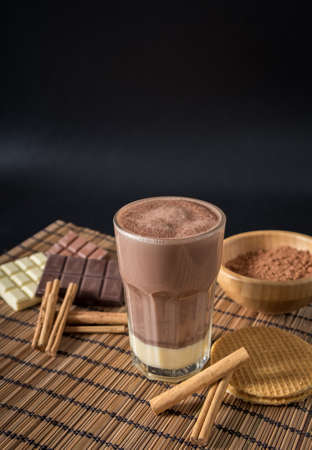 Delicious hot chocolate in a glass with cinnamonの写真素材