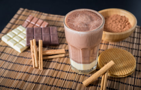 Delicious hot chocolate in a glass with cinnamonの写真素材