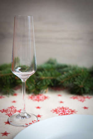 Christmas table decoration with glass, dish and pine treeの写真素材