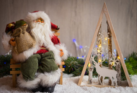 Christmas ornaments with snow, pine tree and xmas lightsの写真素材