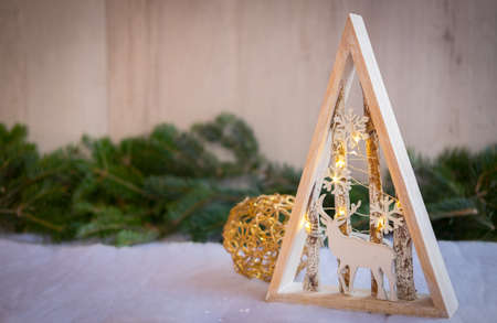 Christmas ornaments with snow, pine tree and xmas lightsの写真素材