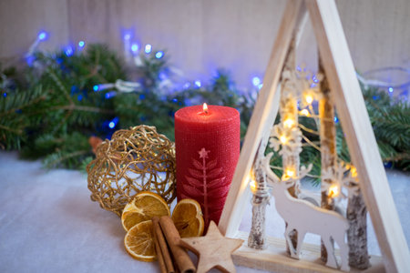 Christmas ornaments with snow, pine tree and xmas lightsの写真素材