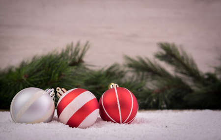Christmas ornaments with snow and pine treeの写真素材