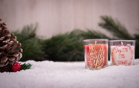 Christmas ornaments with snow, pine tree, cone and candlesの写真素材