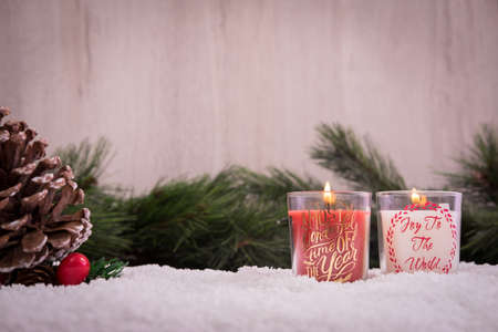 Christmas ornaments with snow, pine tree, cone and candlesの写真素材