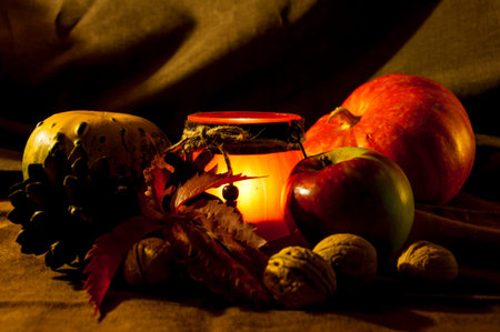 Autumnal still life with pumpkins, apple and nutsの写真素材
