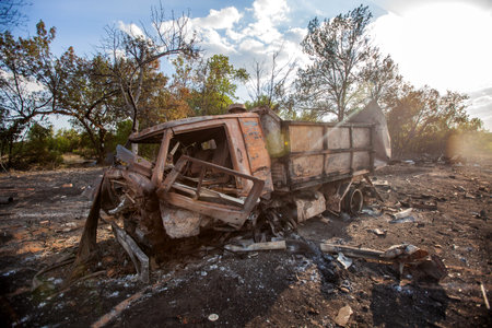 destroyed military truck, War actions aftermath, Ukraine and Donbass conflict, burnt military truckの写真素材