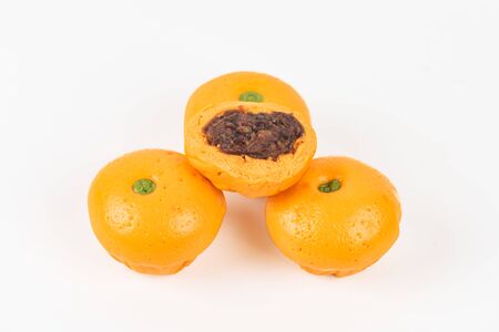 Cute pork buns in a form of oranges
 on white backgroundの写真素材
