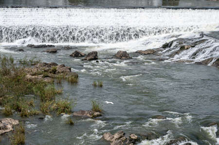 Rocks and water by the riverの写真素材