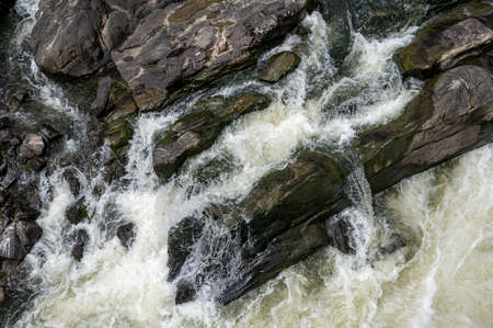 Rocks and water by the riverの写真素材