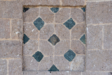 There are different patterns or textures of stones on the stone wallの写真素材